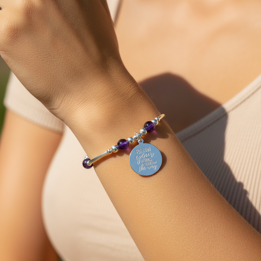 Model wearing a "Follow your dreams, they know the way" amethyst & sterling silver women's stacking bracelet by My Silver Wish