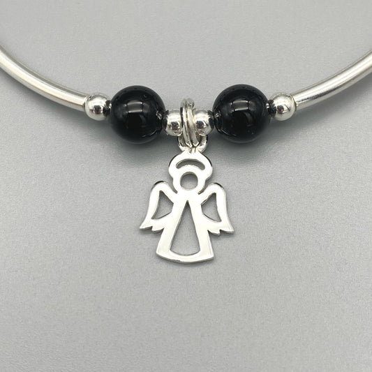 Closeup of Angel charm black onyx gemstone women's sterling silver stacking bracelet by My Silver Wish