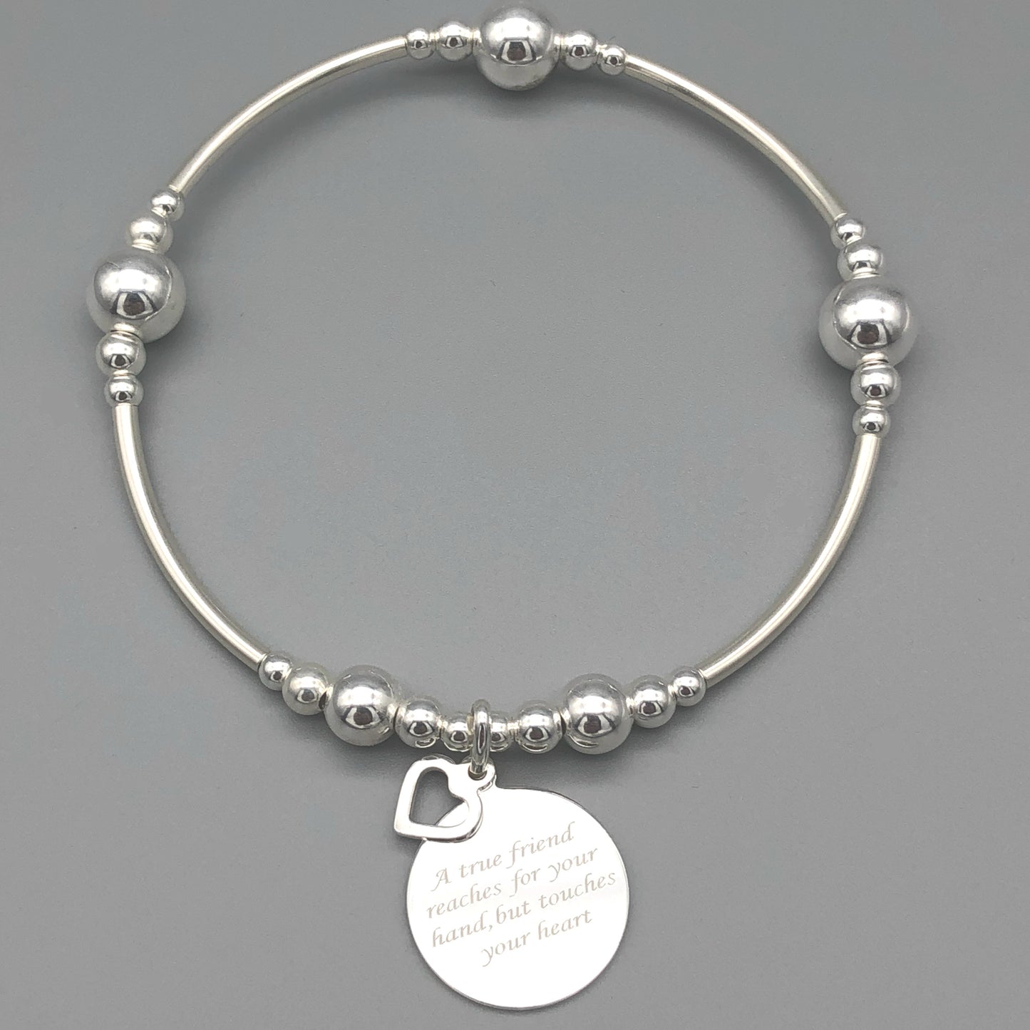 "A true friend reaches for your hand, but touches your heart" women's sterling silver stacking bracelet by My Silver Wish