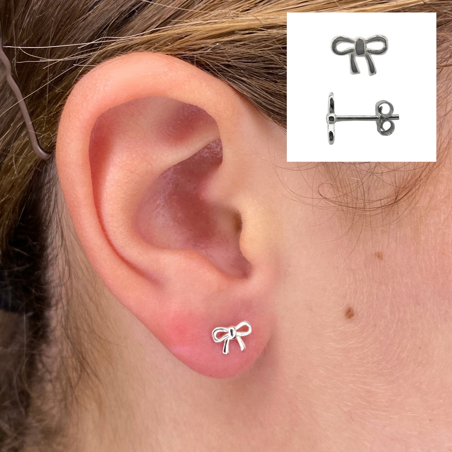 Closeup of ribbon bow sterling silver stud earrings by My Silver Wish