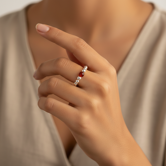 Model wearing a Carnelian & sterling silver bead women's stacking charm ring by My Silver Wish