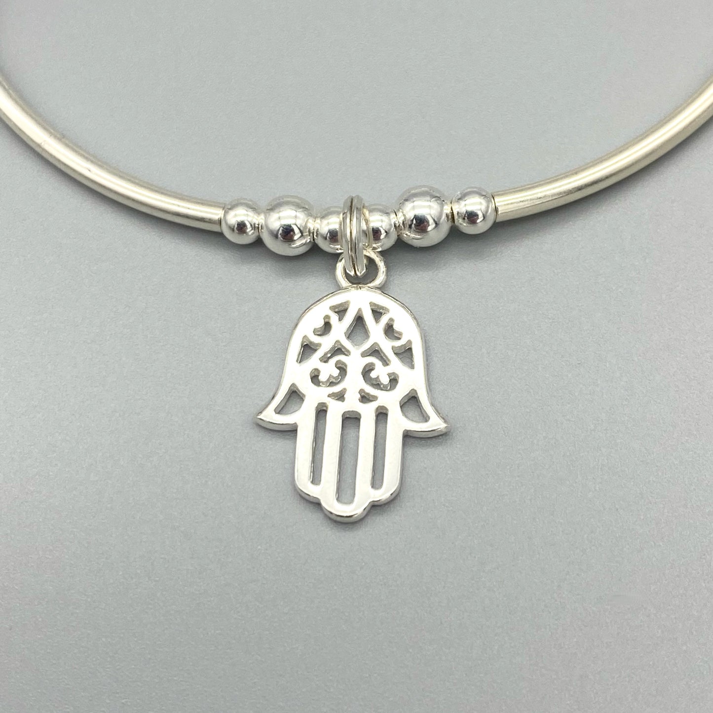 Closeup of Hamsa hand charm chakra crystal sterling silver stacking bracelet for her by My Silver Wish