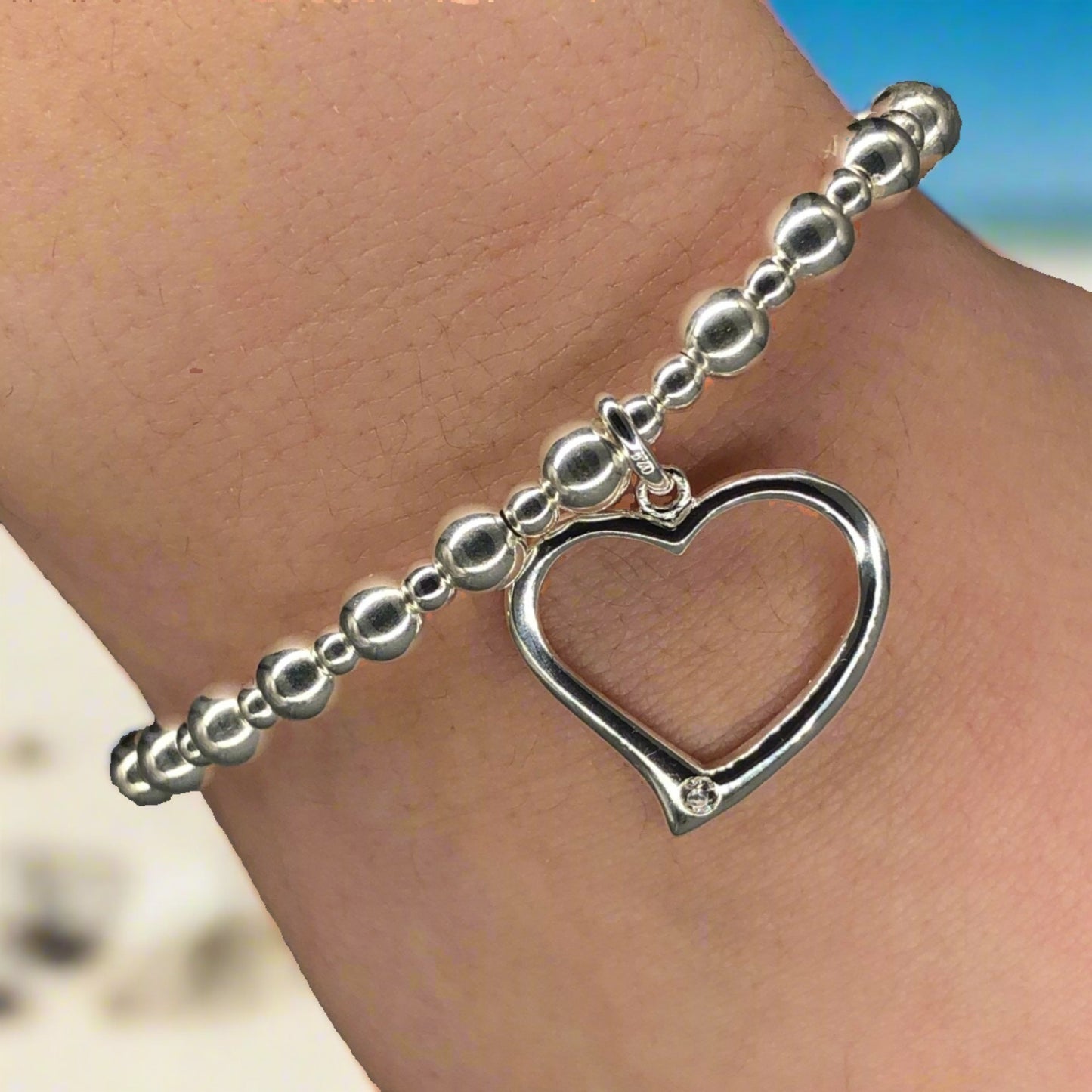 Closeup of Large open heart sterling silver stacking charm bracelet by My Silver Wish