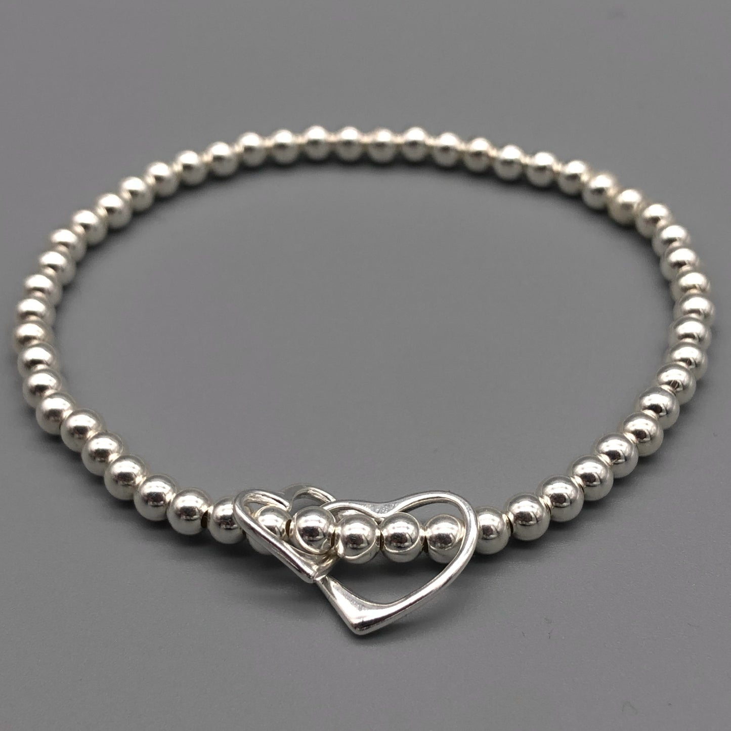 Interlinked open heart charm sterling silver hand-made women's stacking bracelet