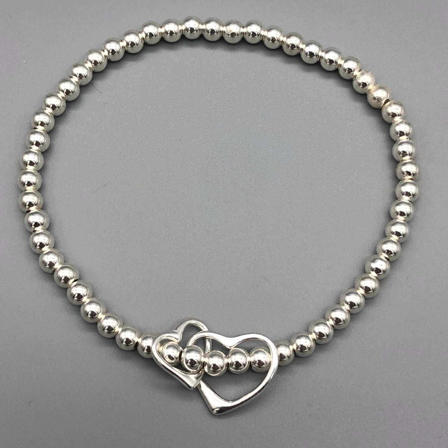 Interlinked open heart charm sterling silver hand-made women's stacking bracelet