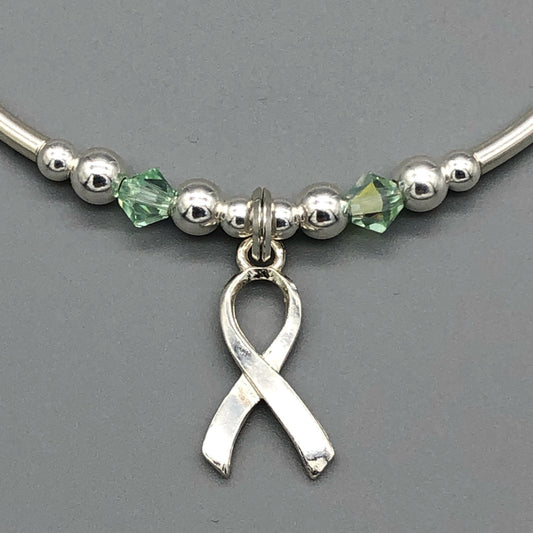 Closeup of Mental Health Awareness ribbon charm sterling silver hand-made women's stacking bracelet by My Silver Wish
