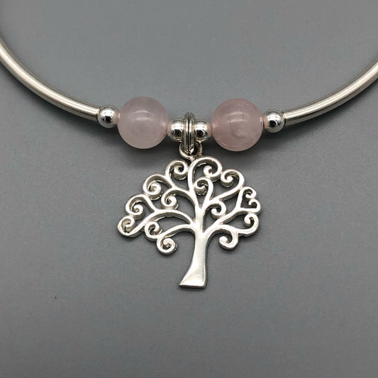 Closeup of Tree of Life charm rose quartz & silver women's stacking charm bracelet by My Silver Wish