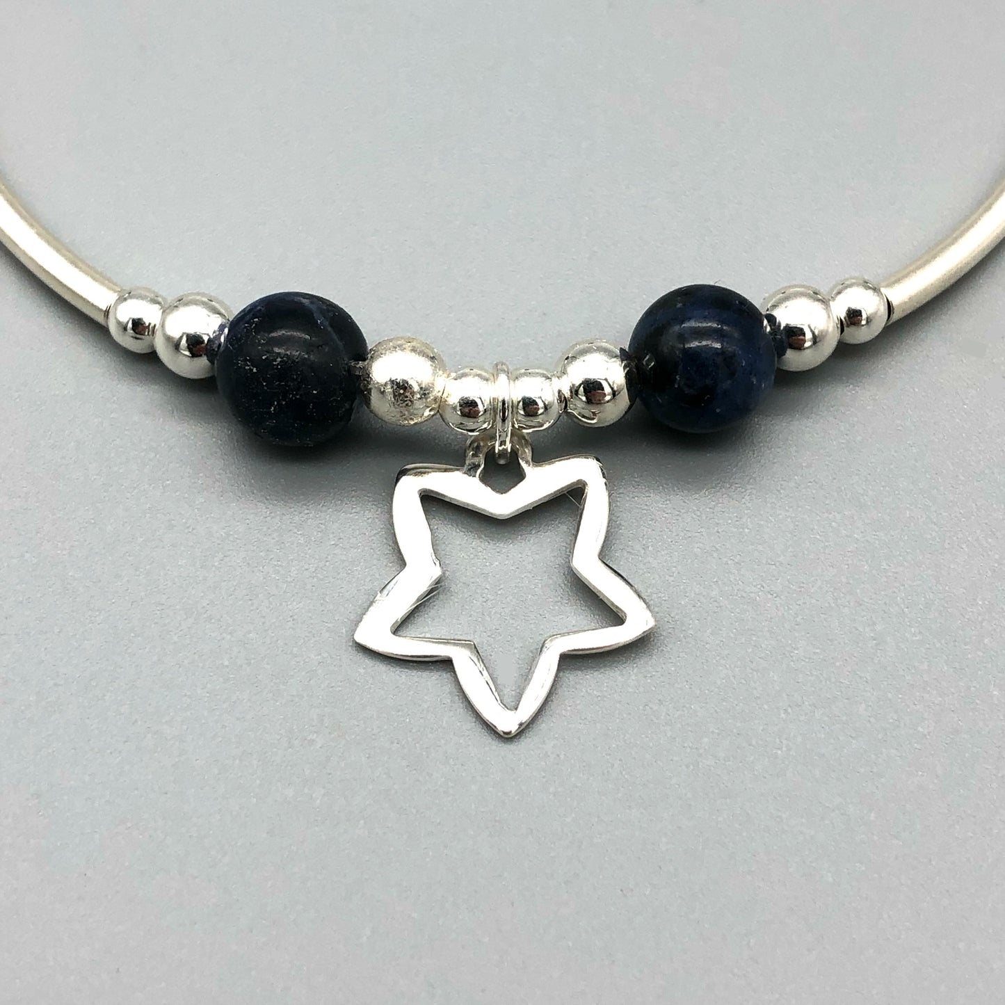 Closeup of Star charm sodalite healing stone & sterling silver beads women's stacking bracelet by My Silver Wish