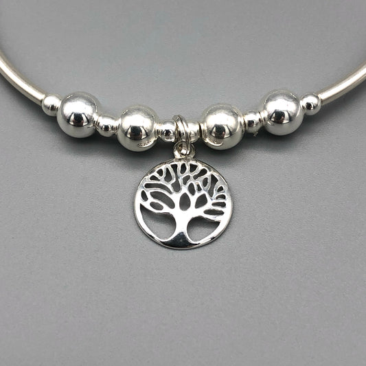 Closeup of Tree of Life charm sterling silver women's hand-made stacking bracelet by My Silver Wish