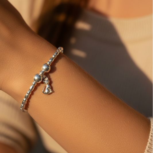 Woman wearing a Cat charm sterling silver stacking bracelet for her by My Silver Wish