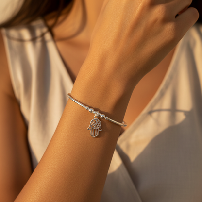 Woman wearing a Hamsa hand charm chakra crystal sterling silver stacking bracelet for her by My Silver Wish