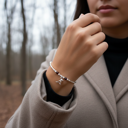Model wearing a Robin charm red crystal sterling silver stacking bracelet for her by My Silver Wish
