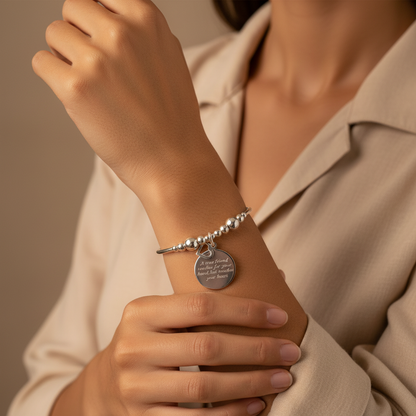 Woman wearing "A true friend reaches for your hand, but touches your heart" women's sterling silver stacking bracelet by My Silver Wish