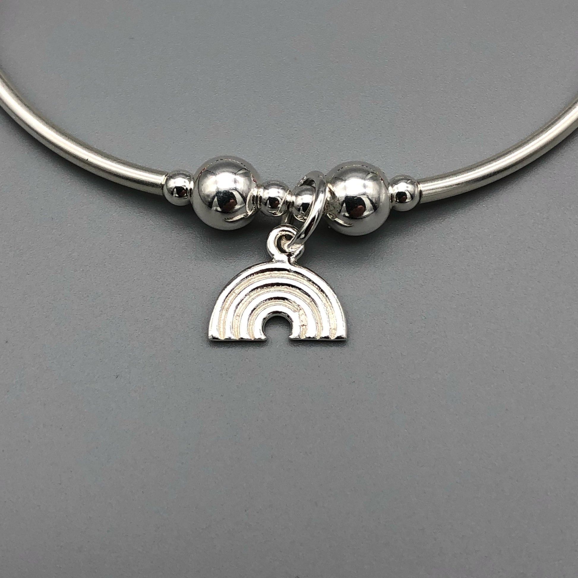 Closeup of Rainbow Women's Sterling Silver Stacking Charm Bracelet by My Silver Wish
