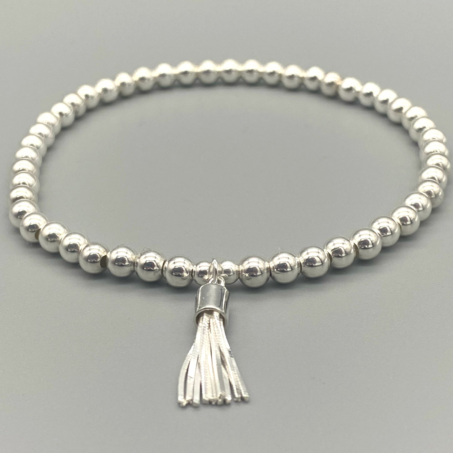Tassel charm sterling silver women's beaded stacking bracelet by My Silver Wish